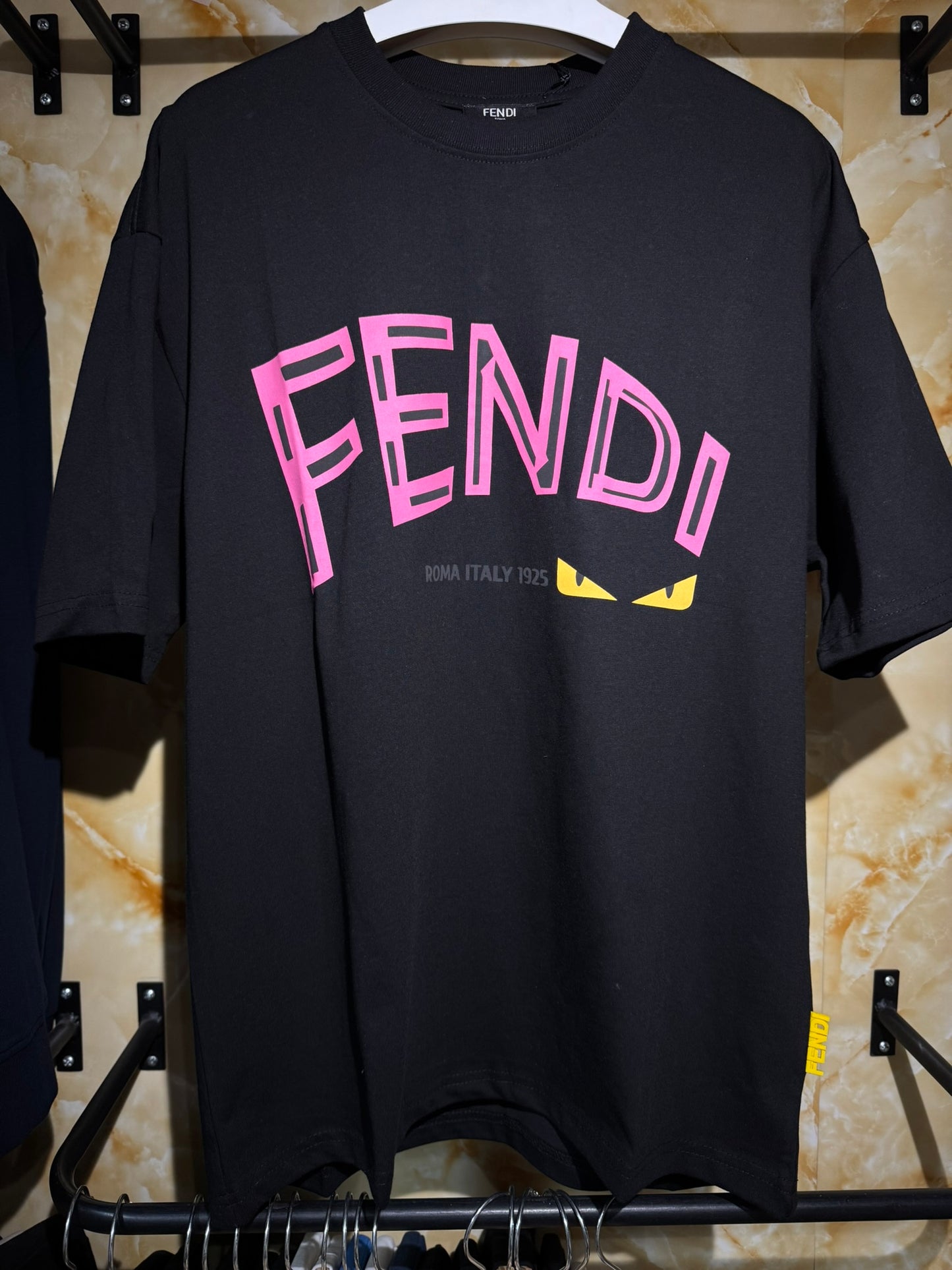 Fendi “Bag Bugs Eyes Logo T-Shirt”.