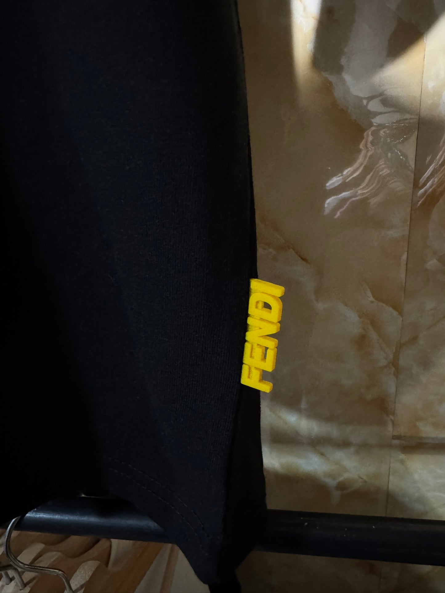 Fendi “Bag Bugs Eyes Logo T-Shirt”.