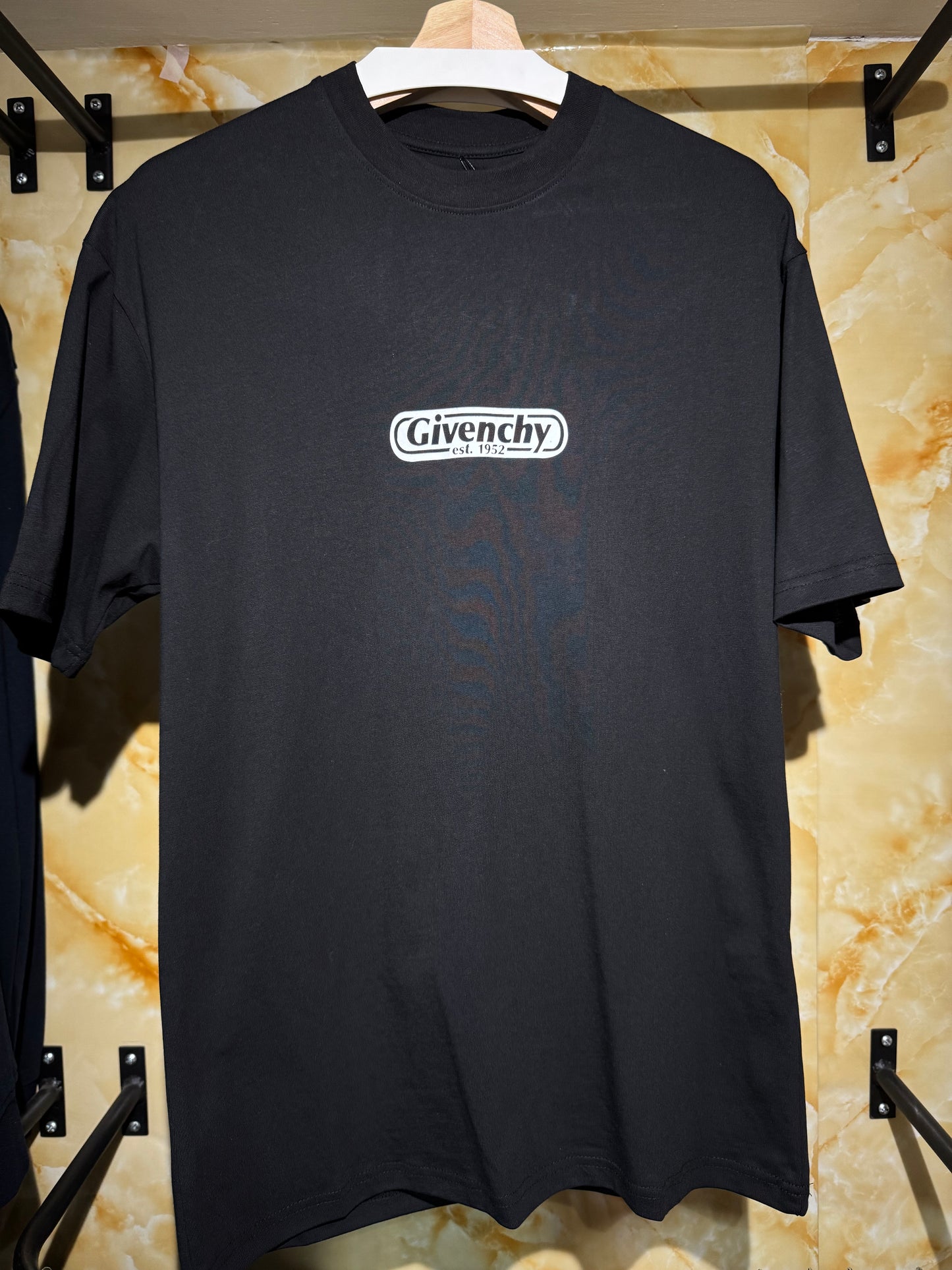 Givenchy “Logo Est. 1952 T-Shirt”.
